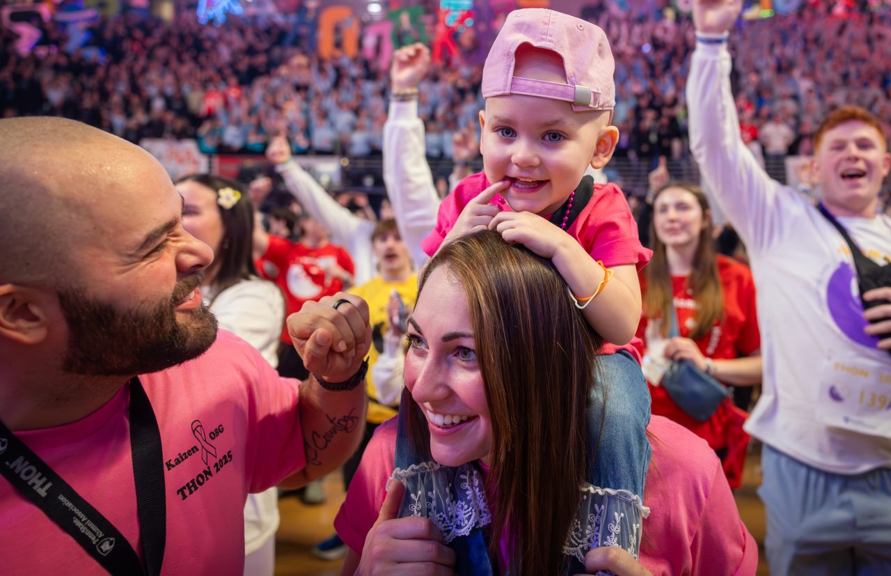 Four Diamonds child Blakely K., 2, dances with her mother, Victoria and her father Spencer during THON at the Bryce Jordan Center on Friday, Feb. 21, 2025.