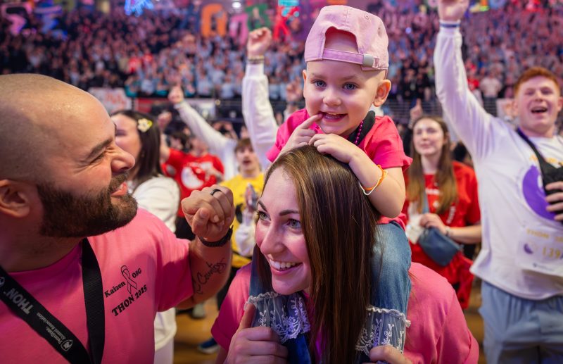 Four Diamonds child Blakely K., 2, dances with her mother, Victoria and her father Spencer during THON at the Bryce Jordan Center on Friday, Feb. 21, 2025.