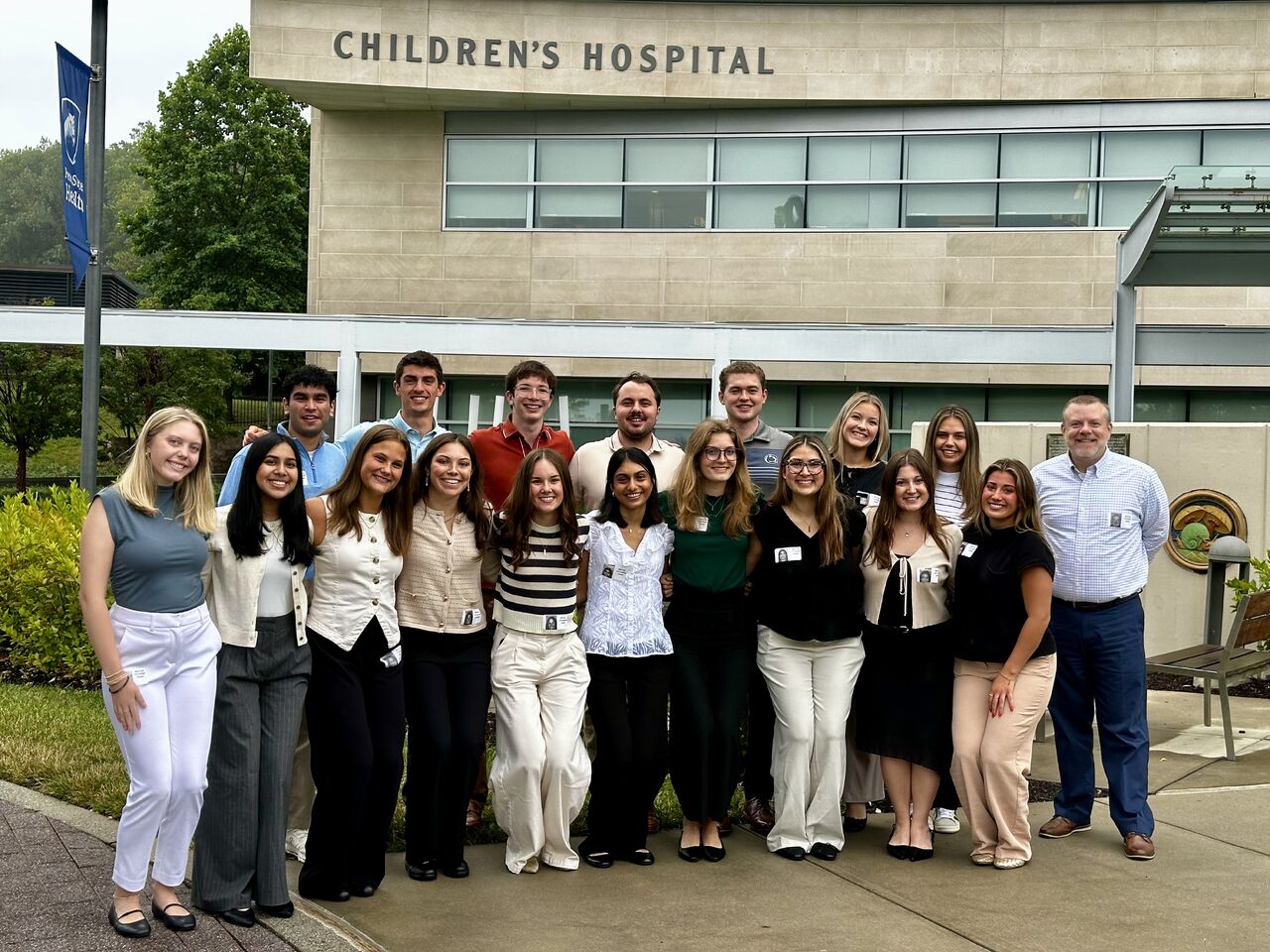THON leaders posing in front of Penn State Children's Hospital.