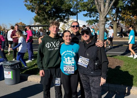 Viv and her family pose together before the THON 5K after her childhood cancer journey.
