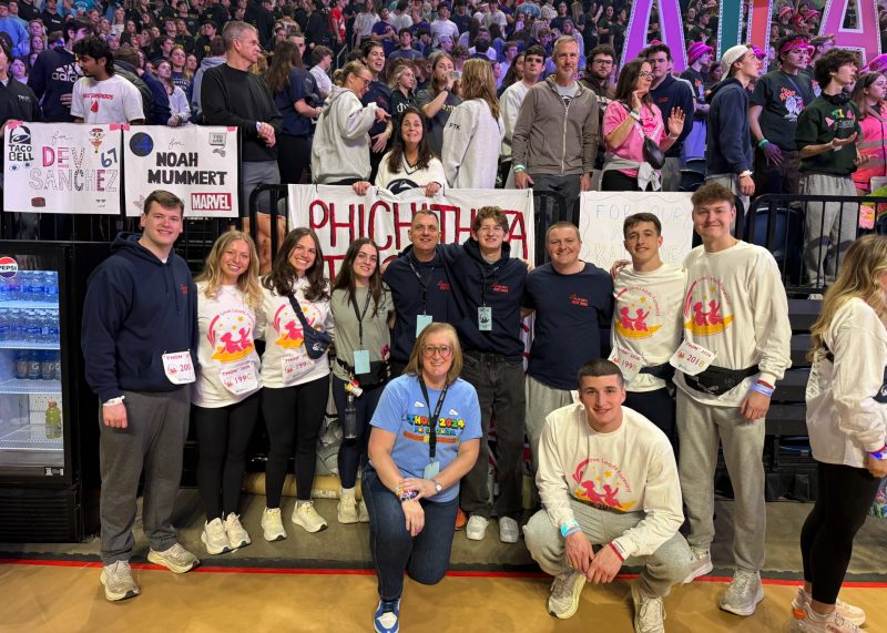 Viv, her family and members of Phi Chi Theta gather during THON Weekend to support Four Diamonds.